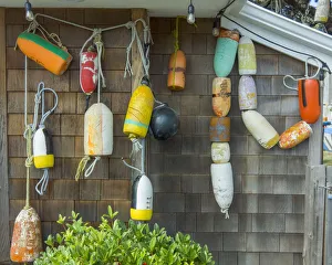 USA, Oregon, Cannon Beach. Buoys hang on side of house USA, Oregon, Cannon Beach. Buoys hang on side of house