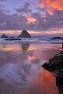USA, Oregon, Oceanside. Sunset on beach and sea stacks USA, Oregon, Oceanside. Sunset on beach and sea stacks