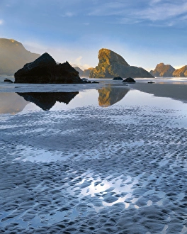 USA, Oregon, Pistol River State Park. Morning light on rocks at Meyers Beach. Credit as USA, Oregon, Pistol River State Park. Morning light on rocks at Meyers Beach. Credit as