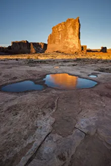 USA, Utah. The Organ reflected in an ice covered pool, Arches National Park USA, Utah. The Organ reflected in an ice covered pool, Arches National Park
