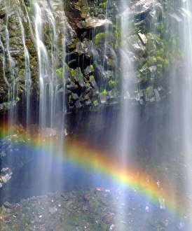 USA; Washington; Mount Rainer National Park; Rainbow at the base of a waterfall USA; Washington; Mount Rainer National Park; Rainbow at the base of a waterfall