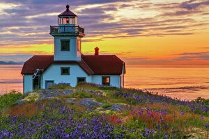 Images Dated 5th May 2014: USA, Washington, San Juan Islands. Patos Lighthouse and camas flowers at sunset. Credit as