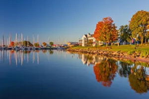 USA, Wisconsin. Fall colors reflected on the still waters of the harbor in Bayfield USA, Wisconsin. Fall colors reflected on the still waters of the harbor in Bayfield