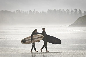 Vancouver Island, Pacific Rim National Park. Surfers on the beach Vancouver Island, Pacific Rim National Park. Surfers on the beach