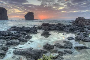 View from beach at Manele Bay of Puu Pehe (Sweetheart Rock) at sunrise View from beach at Manele Bay of Puu Pehe (Sweetheart Rock) at sunrise