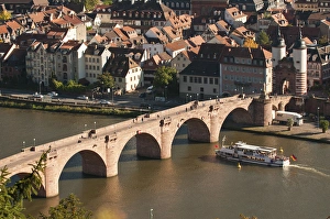 View of tour boat passing under the Alte Brucke or Old Bridge, Neckar River Heidelberg Castle View of tour boat passing under the Alte Brucke or Old Bridge, Neckar River Heidelberg Castle
