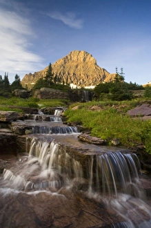 Water cascades down from Reynold Mountain at Logan Pass in Glacier National Park Montana Water cascades down from Reynold Mountain at Logan Pass in Glacier National Park Montana