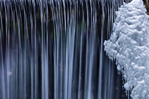 Water flowes by ice formation along Falls Creek in winter near Nelson, British Columbia Water flowes by ice formation along Falls Creek in winter near Nelson, British Columbia