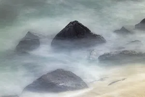 Waves crashing over lava rocks on shoreline of Espanola Island, Galapagos Islands, Ecuador Waves crashing over lava rocks on shoreline of Espanola Island, Galapagos Islands, Ecuador