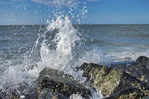 Waves crashing on rocks, Honeymoon Island State Park, Dunedin, Florida, USA Waves crashing on rocks, Honeymoon Island State Park, Dunedin, Florida, USA