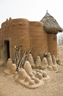 West Africa, Africa, Togo, Tamberma Region. Batammariba fetish objects against traditional West Africa, Africa, Togo, Tamberma Region. Batammariba fetish objects against traditional