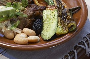White bean and onion salad, grilled vegetables, baby suckling pig pork chops. Traditional White bean and onion salad, grilled vegetables, baby suckling pig pork chops. Traditional