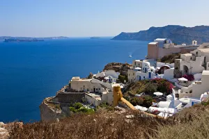 White houses on the coast of Aegean Sea. Oia, Santorini Island, Greece White houses on the coast of Aegean Sea. Oia, Santorini Island, Greece