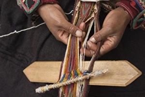 Woman in traditional dress weaving using a backstrap loom (close-up of hands), Chinchero Woman in traditional dress weaving using a backstrap loom (close-up of hands), Chinchero