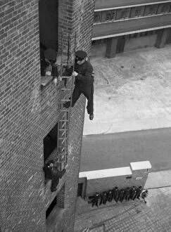 Climbing Collection: Firefighter during hook ladder practice