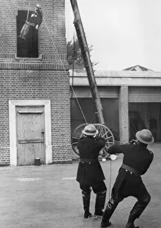 Training Gallery: Trainee lowered from tower during exercise drill, WW2
