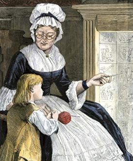 Colonial boy learning to read at home Colonial boy learning to read at home