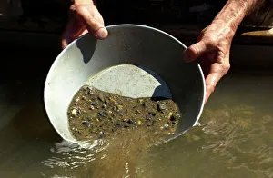 <b class=qtipBold><figcaption>Panning for gold, California</figcaption></b><br>Reenactor panning for gold on the American River, where the Gold Rush started, Coloma, California. Digital photograph<br><em>© N.Carter/North Wind Picture Archives</em> Panning for gold, California