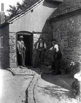 Images Dated 1st August 2013: Three country gentlemen chatting in a farmyard at Upperton, Sussex. August 1936