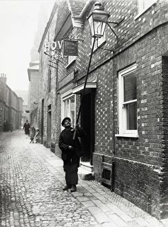 Images Dated 19th January 2012: Lamplighter in Lombard St. Petworth, 1931