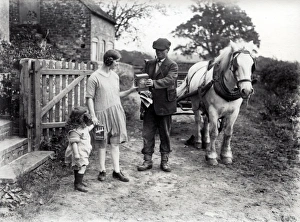 Village carrier out on deliveries with his horse and cart Village carrier out on deliveries with his horse and cart