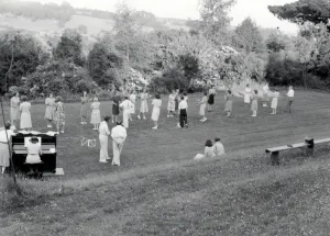 Prints of Folk dancers on the vicarage lawn accompanied by lady on upright piano George Garland Collection West Sussex Record Office Ref. No. Garland N28265 Dance Prints: Bury Vicarage Folk Dancing Party Print 1947