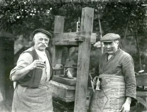 Prints of Two men with a cider press at Hillgrove, Sussex November 1933 George Garland Collection West Sussex Record Office Ref No: Garland N8161 West Sussex Prints: Cider Press Print at Hillgrove, Sussex