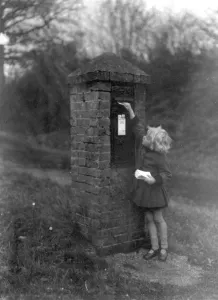 Print of a girl posting Christmas cards in 1930
