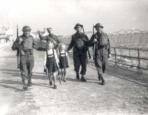 Prints of On the Esplanade at Bognor Regis Bedfordshire Prints: Print of two girls being shooed away by soldiers on Bognor Regis Esplanade