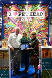 <b class=qtipBold><figcaption>2018 Best Trade Stand</figcaption></b><br>best medium stand award pet head Rodger Mugford, Company of Animals and Jade Childs<br><em>© Georgia Drury / The Kennel Club</em> 2018 Best Trade Stand