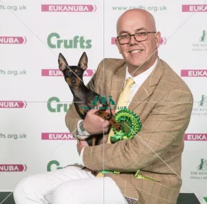 <b class=qtipBold><figcaption>Crufts 2017</figcaption></b><br>Nick Gourley from Belpher with Coco a English Toy Terrier (Black & Tan), which was the Best of Breed winner today (Friday 10.03.17), the second day of Crufts 2017, at the NEC Birmingham. *** Local Caption *** Image OK for any Kennel Club and/or Crufts use including press and editorial use must credit photographer and the Kennel Club Crufts 2017