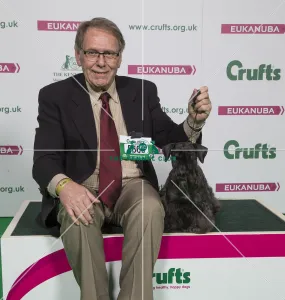<b class=qtipBold><figcaption>Crufts 2018</figcaption></b><br>Picture shows Nick Fletcher from Dallas, Texas with Nina a Cesky Terrier, which was the Best of Breed winner today, (Friday 09.03.18), the second day of Crufts 2018, at the NEC Birmingham.<br><em>© Flick.digital</em> Crufts 2018