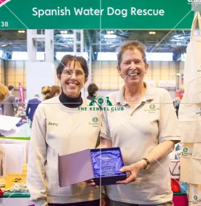 <b class=qtipBold><figcaption>Photo Call</figcaption></b><br>Photo Call Winner breeder club stand, Spanish Water Dog Rescue<br><em>© Roger Sjolstad / The Kennel Club</em> Photo Call