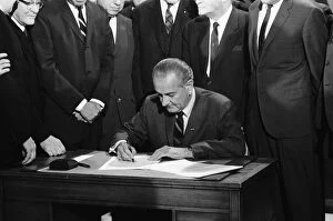 Signing Gallery: (1908-1973). 36th President of the United States. Johnson signing the Civil Rights Bill