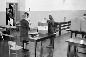 An African American voter casting her vote at a polling station at Cardozo High School An African American voter casting her vote at a polling station at Cardozo High School