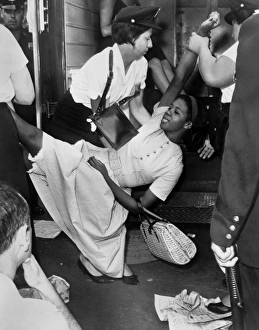 African American woman being carried to a police wagon during a Civil Rights demonstration African American woman being carried to a police wagon during a Civil Rights demonstration