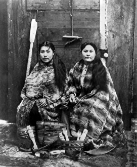 ALASKA: TLINGIT WOMEN, c1900. Two Tlingit women, wearing robes of eider duck feather ALASKA: TLINGIT WOMEN, c1900. Two Tlingit women, wearing robes of eider duck feather