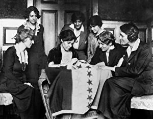 ALICE PAUL (1885-1977). American social reformer. Fellow suffragettes watch Alice Paul ALICE PAUL (1885-1977). American social reformer. Fellow suffragettes watch Alice Paul