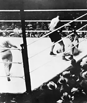 American boxer. Gene Tunney down for the famous long count in the championship bout with Dempsey at Soldier Field