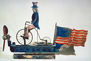 American whirligig of Uncle Sam on bicycle. Wood and metal, c1876 American whirligig of Uncle Sam on bicycle. Wood and metal, c1876