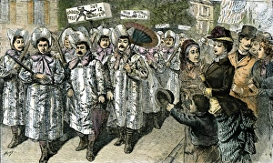 An amused crowd of onlookers at Rahway, New Jersey, watches a parade of men dressed in An amused crowd of onlookers at Rahway, New Jersey, watches a parade of men dressed in