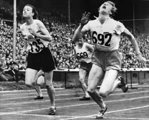 Prints of OLYMPIC GAMES, 1948. Fanny Blankers-Koen of the Netherlands (right) and Maureen Gardner (left) of England finishing the 80 meter hurdle event at Wembley Stadium, London, England, 4 August 1948 Sport Prints: Print of Fanny Blankers-Koen and Maureen Gardner at 80 meter hurdle event