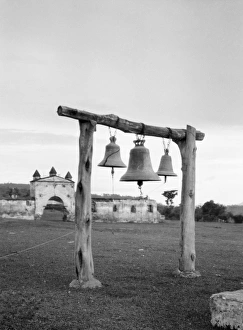 BELLS, c1920. Bells in the yard of a church in Guatemala or Cuba BELLS, c1920. Bells in the yard of a church in Guatemala or Cuba