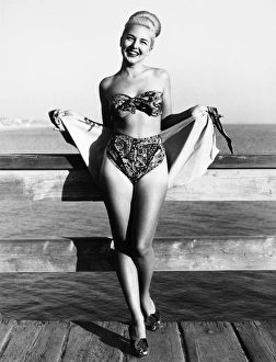 Bette Alden models a three-piece bathing suit designed by Ruth Small of Long Beach Bette Alden models a three-piece bathing suit designed by Ruth Small of Long Beach
