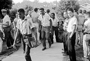 Black students walking through a crowd of white boys in Clinton, Tennessee Black students walking through a crowd of white boys in Clinton, Tennessee