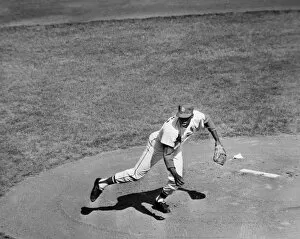 BOB GIBSON (1935- ). American baseball pitcher. Pitching the St. Louis Cardinals to victory over the New York Yankees
