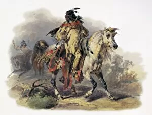 1833 Gallery: BODMER: BLACKFOOT HORSEMAN. A Blackfoot Native American man riding on horseback at Fort McKenzie