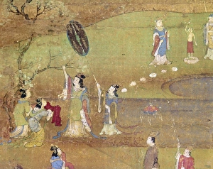 The Buddha is born out of the side of Queen Maya as she reaches up to a branch in her garden The Buddha is born out of the side of Queen Maya as she reaches up to a branch in her garden