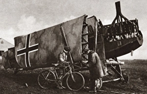Canadian soldiers inspect the armored sides of an all steel German plane. Photograph Canadian soldiers inspect the armored sides of an all steel German plane. Photograph