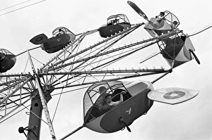 CARNIVAL RIDE, 1942. An airplane carnival ride, Brownsville, Texas. Photograph by Arthur Rothstein, Febraury 1942 CARNIVAL RIDE, 1942. An airplane carnival ride, Brownsville, Texas. Photograph by Arthur Rothstein, Febraury 1942